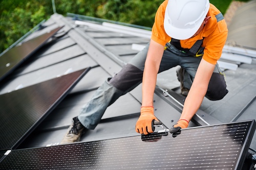 Roofer Installing Energy-Efficient Roofing